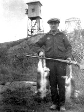Old photo of island rabbit hunter