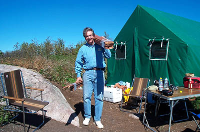 Scott Holman carrying wood